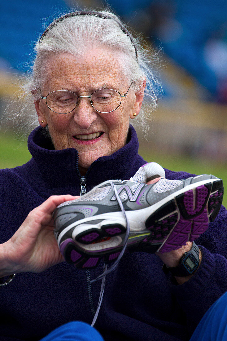 Senior athlete with sports shoe