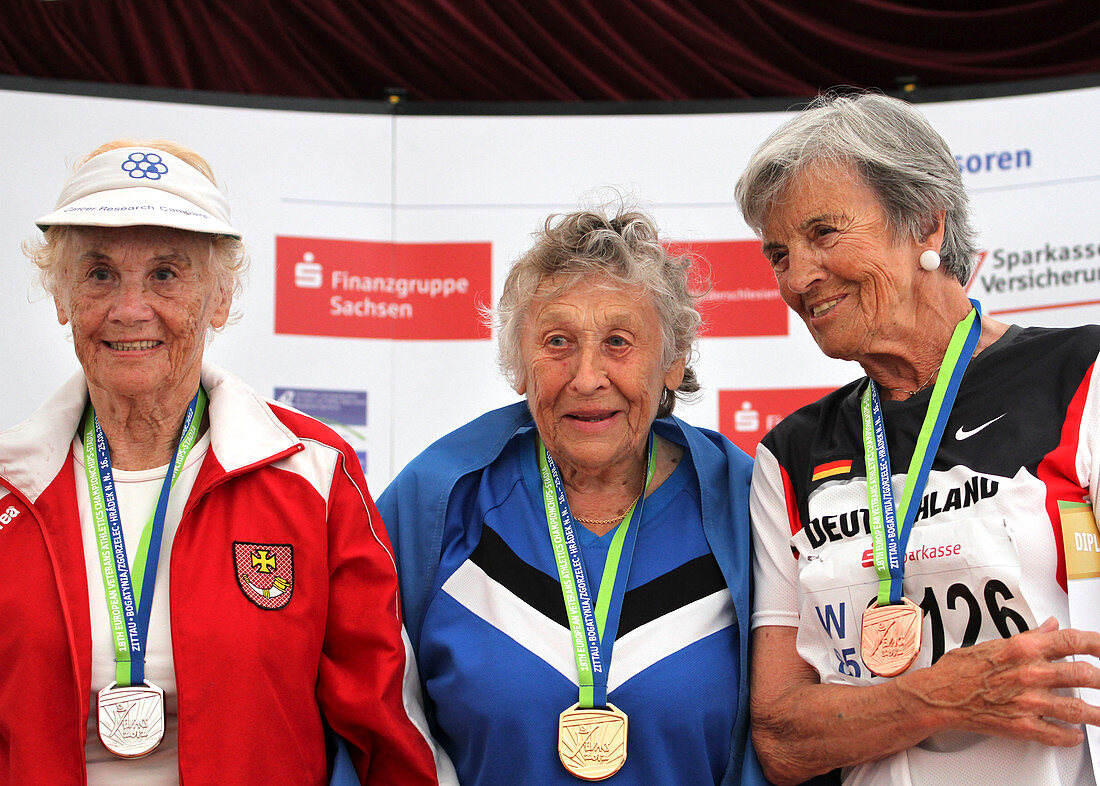 Older female athletes on medals rostrum