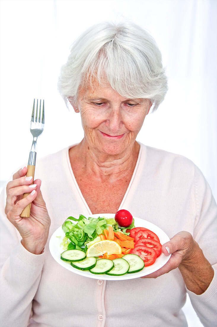 Elderly woman with a salad