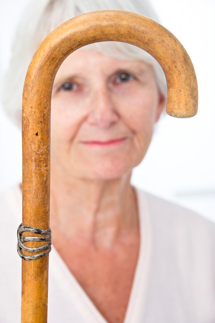 Elderly woman and walking stick