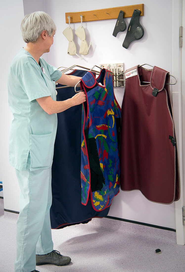 Hospital radiographer with lead apron