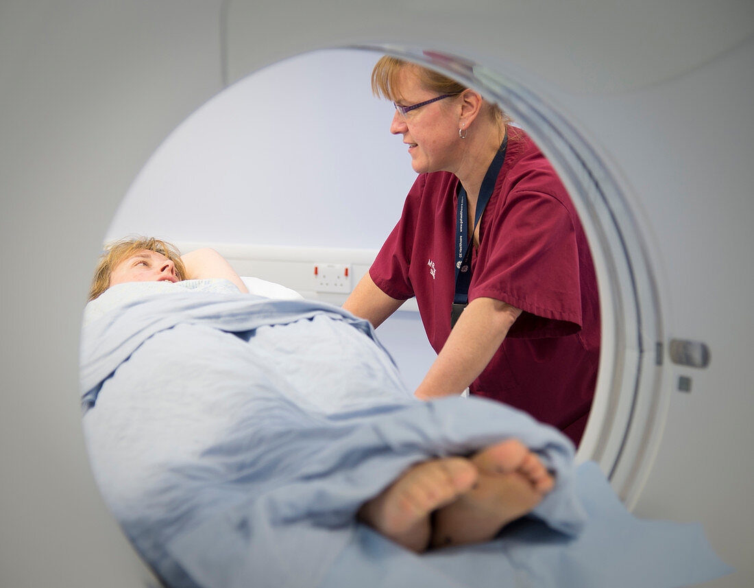 Radiographer preparing a CT scan