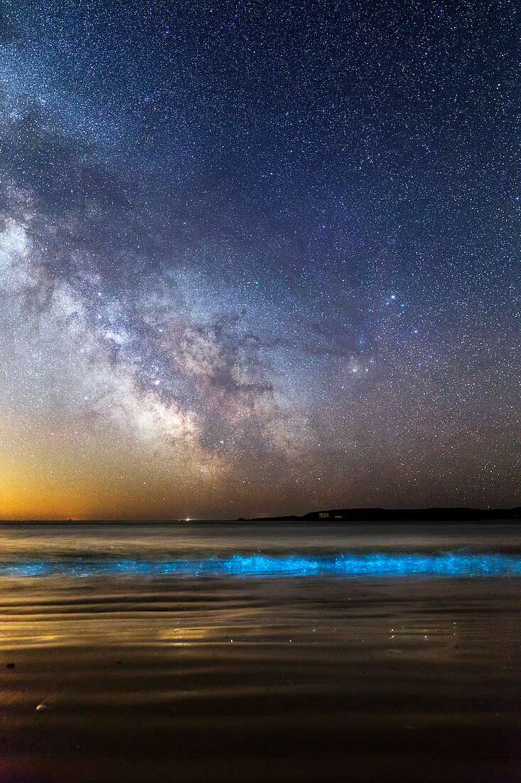 Milky Way over bioluminescent plankton