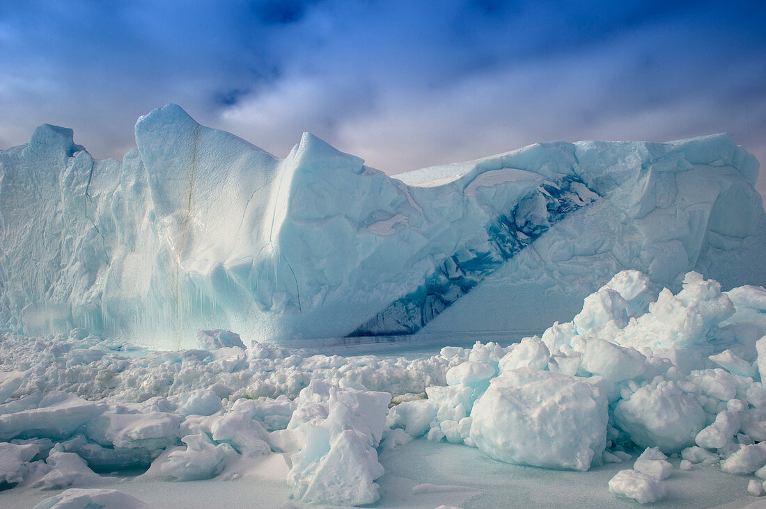 Arctic iceberg in sea ice