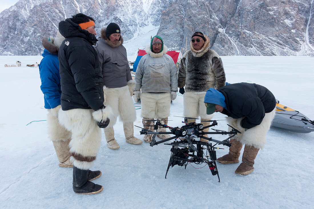 Inuit hunters with octocopter drone