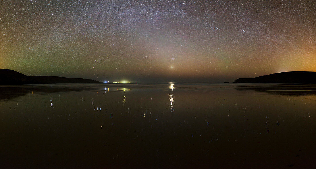 Starlight reflected in a bay at night