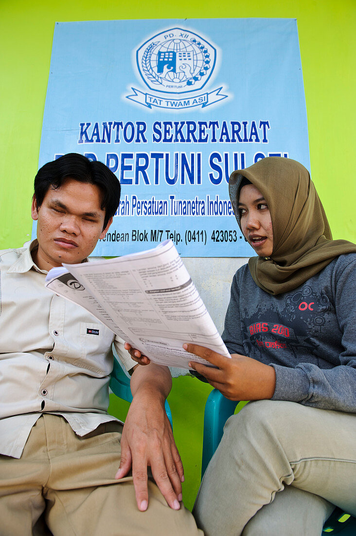 Blind student with helper,Indonesia