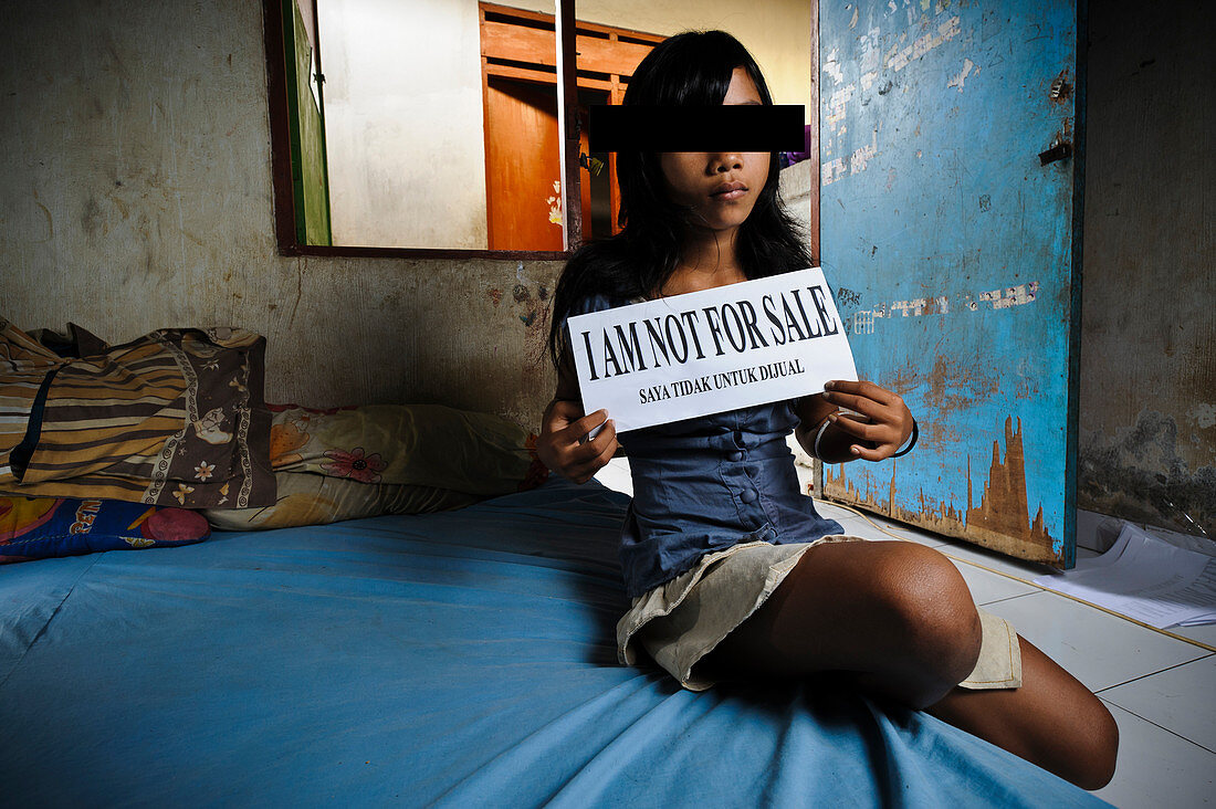 Girl with sign,Indonesia