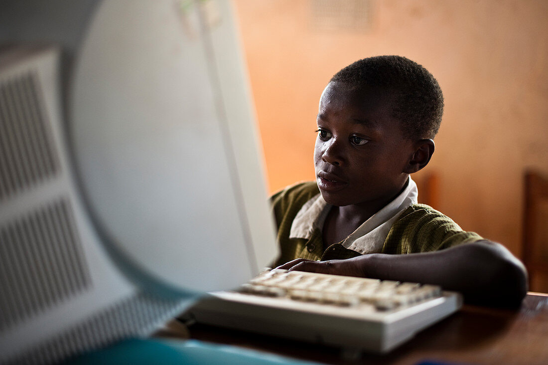 Child learning computer skills,Tanzania