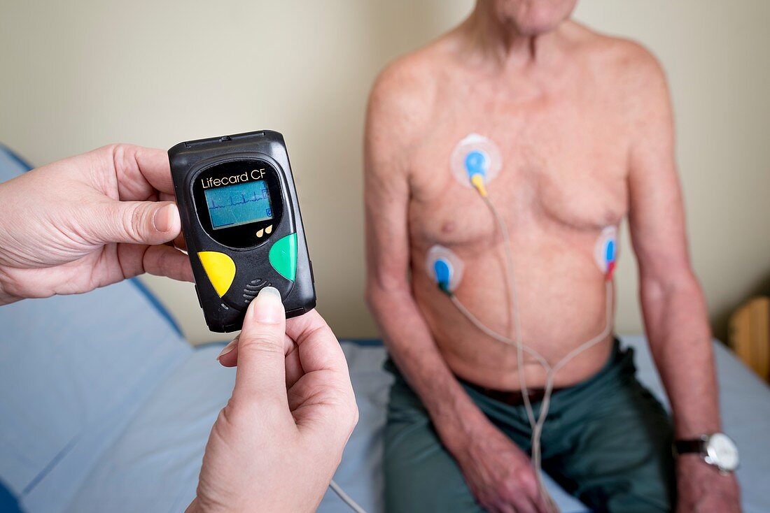 Portable ECG monitor being fitted