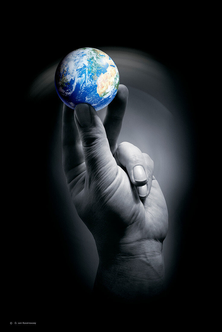 The Earth held by a human hand