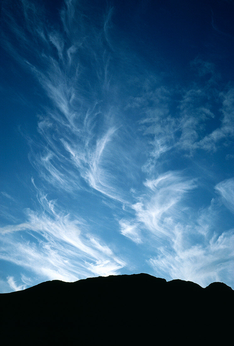 Cirrus clouds over craggy outline of Buckbarrow