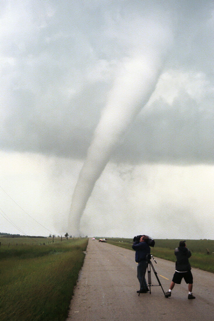Storm chasers videoing a tornado