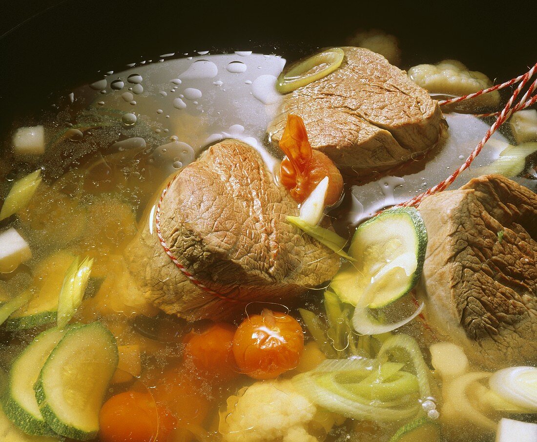 Meat broth with vegetables and beef fillet