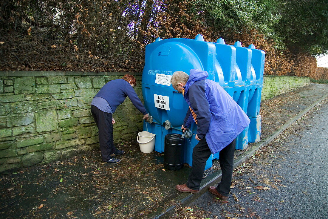 Resident collecting water,Hexham
