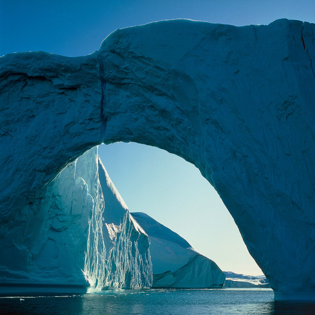 Iceberg with arch in Disco Bay,Greenland