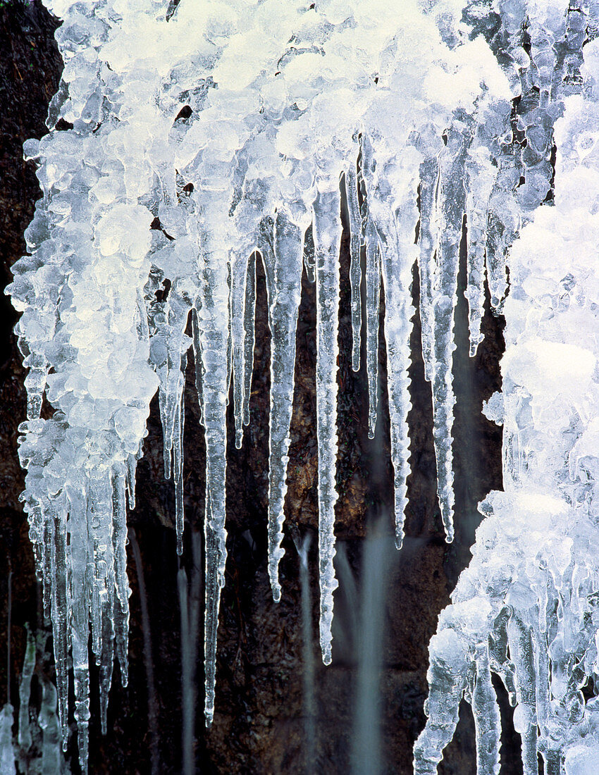 Icicles hanging off rock