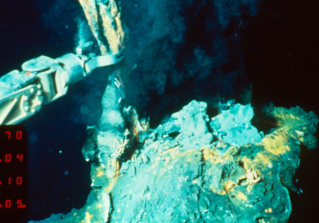 Robot arm taking a sample of a hydrothermal vent