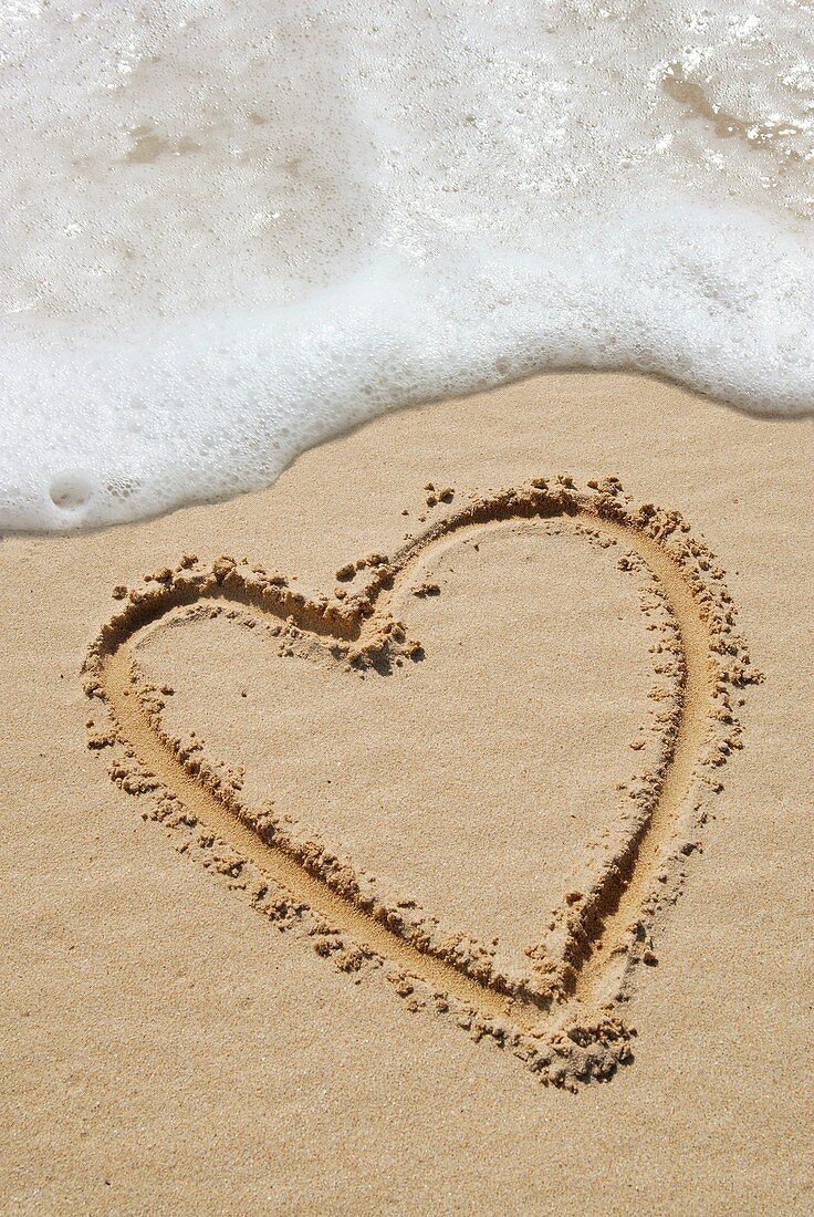 Heart-shape drawn in sand