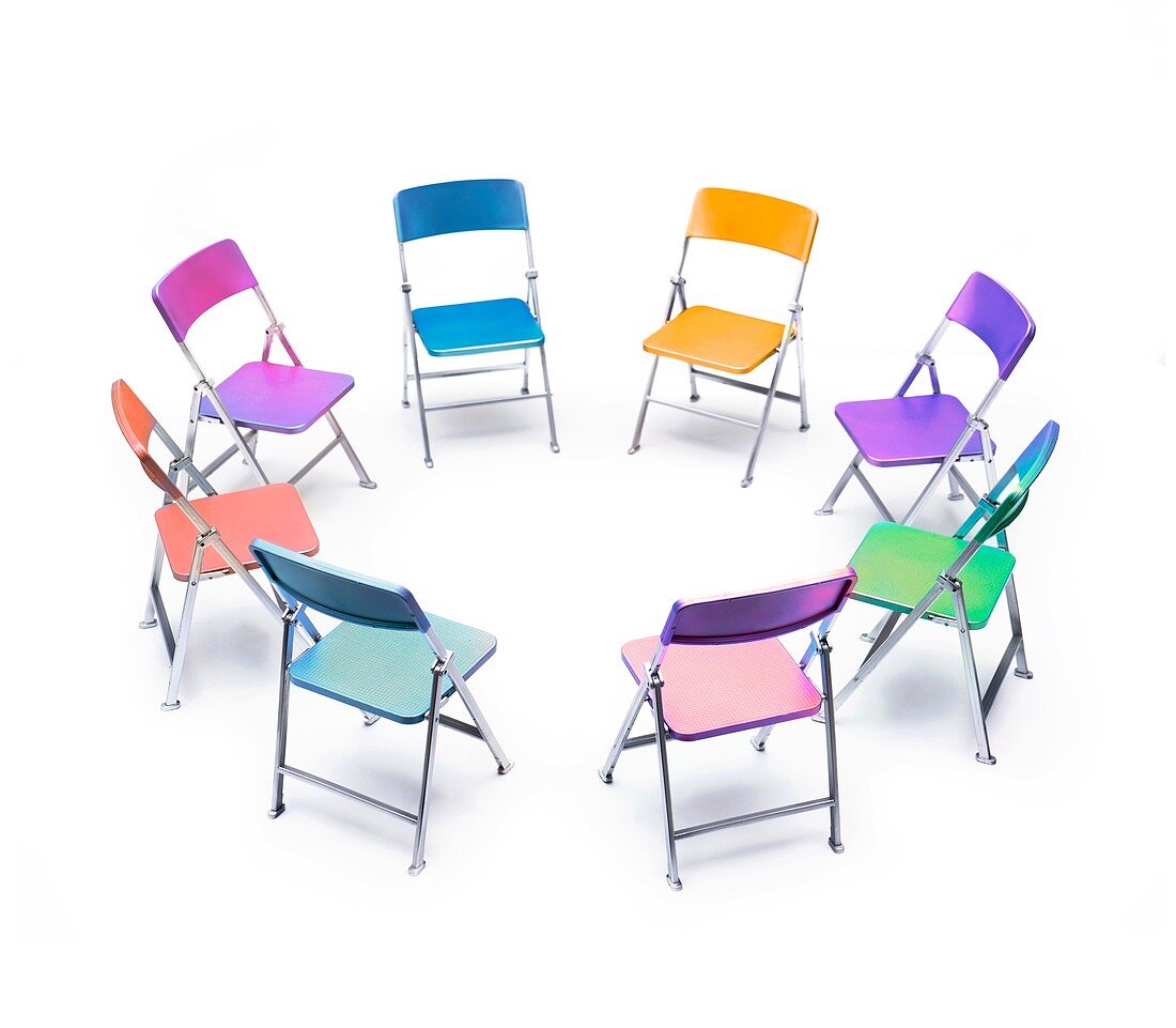 Circle of chairs of different colours