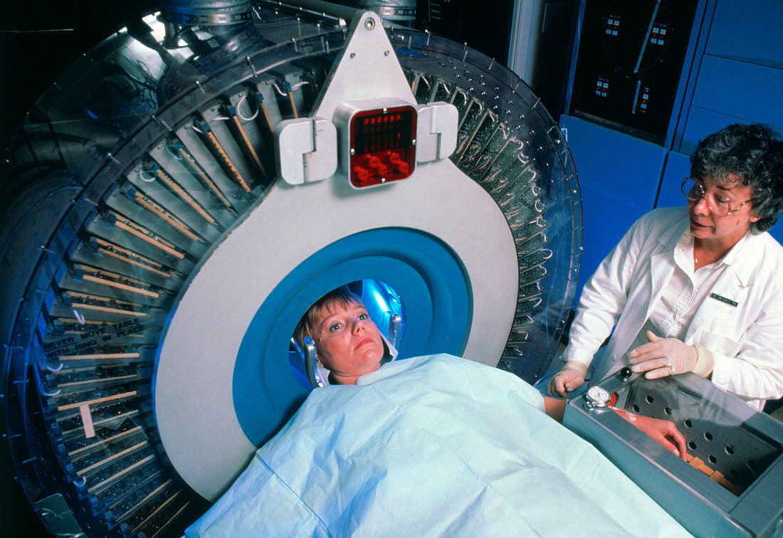 Woman undergoing PET scan