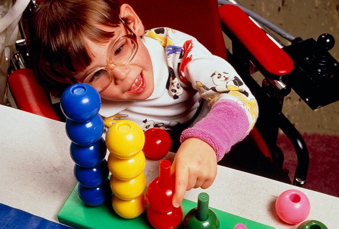 Child with cerebral palsy playing at school