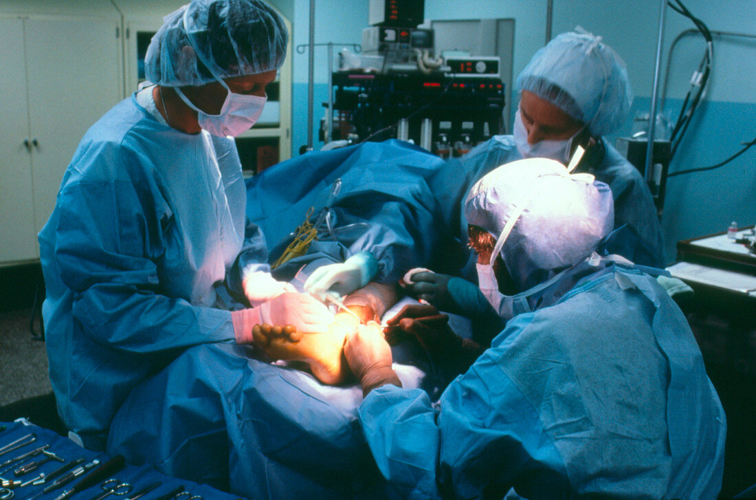Surgical team performing orthapedic surgery