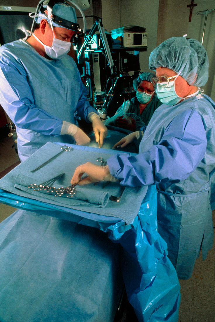 Surgery team performing an operation