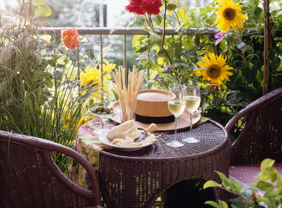 Small Rattan Table on a Flowery Terrace; Wine