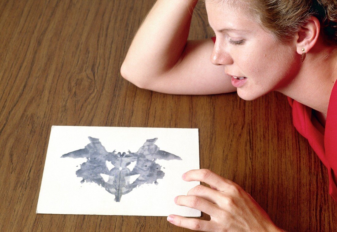 Woman taking Rorschach Ink Blot Test