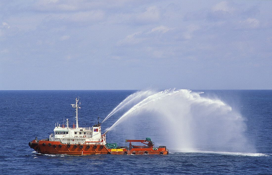 Work boat testing its water canon