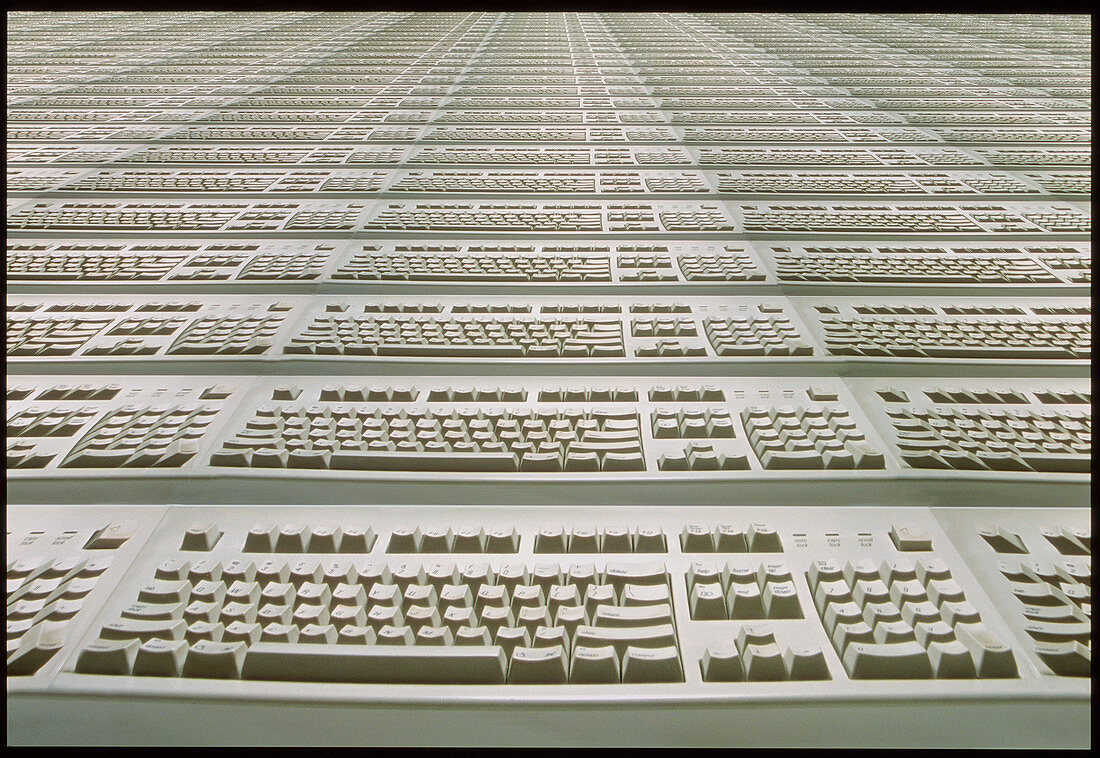 Computer keyboards stretching to the horizon