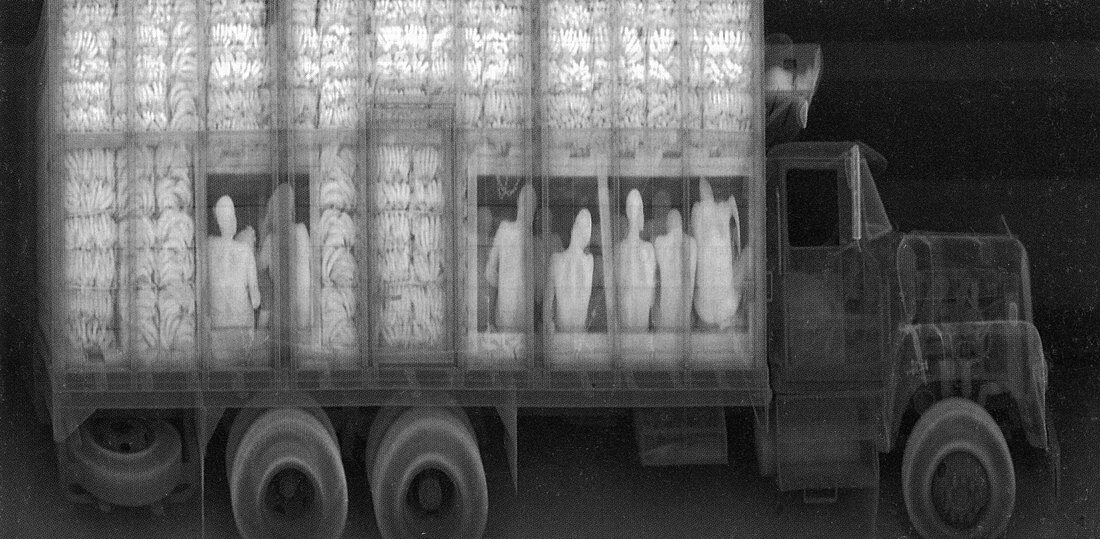 An x-ray of a truck with illegal immigrants