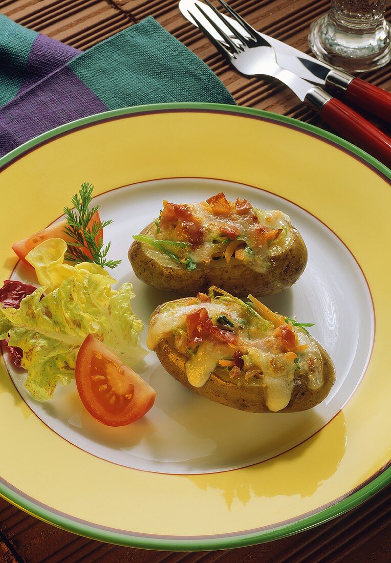 Potatoes stuffed with vegetables & bacon, topped with cheese