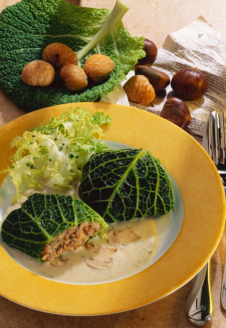 Savoy leaves stuffed with chestnuts with mushroom sauce