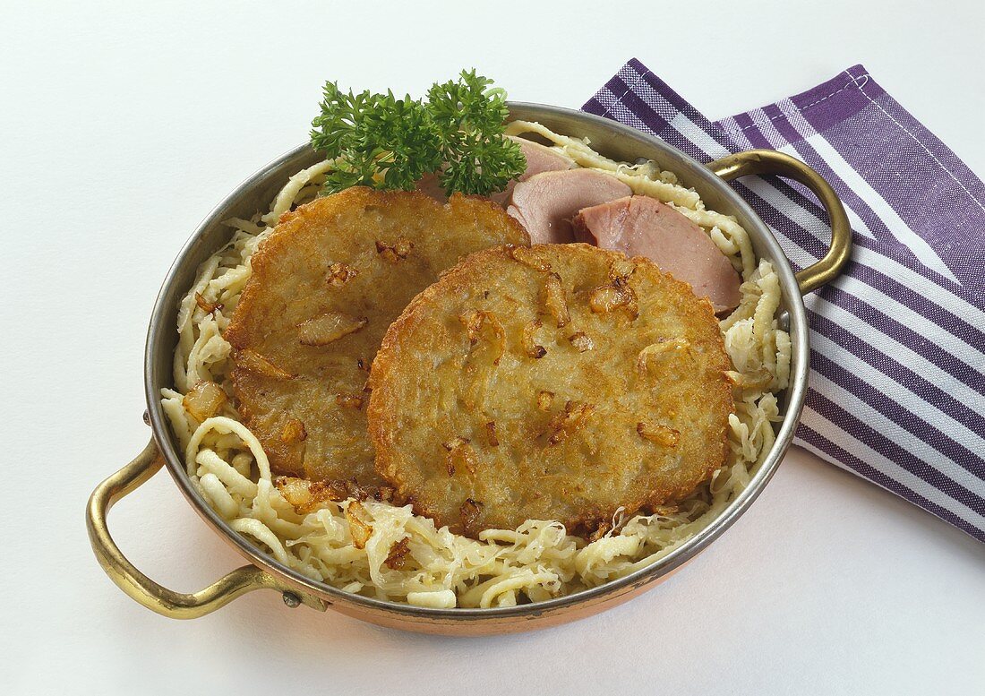 Potato pancakes with Sauerkraut in Copper Pan