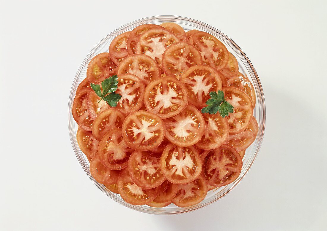 Sliced Tomatoes on a Plate with Parsley