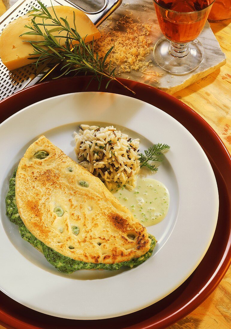 Omelette with spinach & cheese filling, wild rice & herb sauce