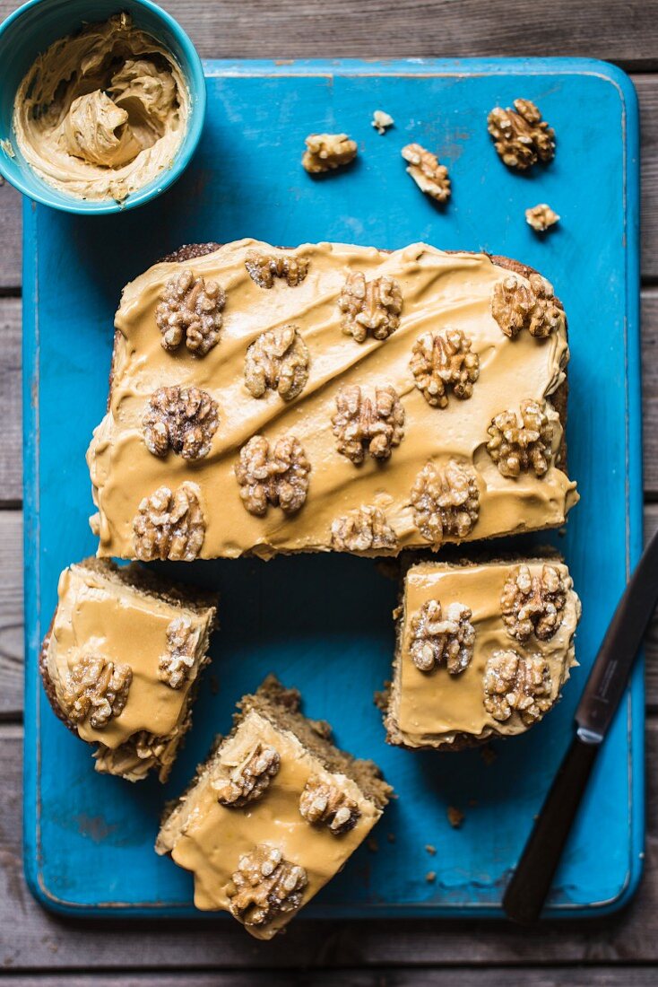 Coffee and walnut traybake with coffee icing, sliced (seen from above)