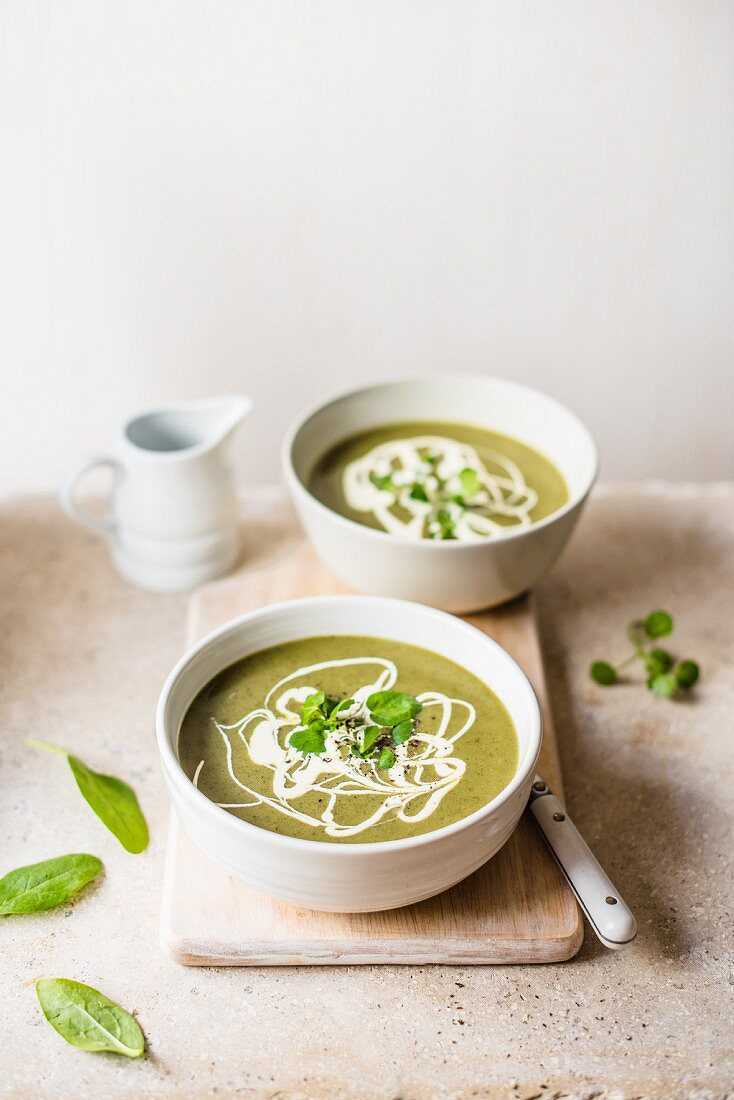 Spinach and watercress soup with cream and black pepper
