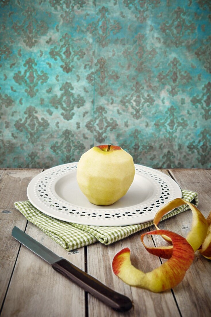 A peeled apple on a plate