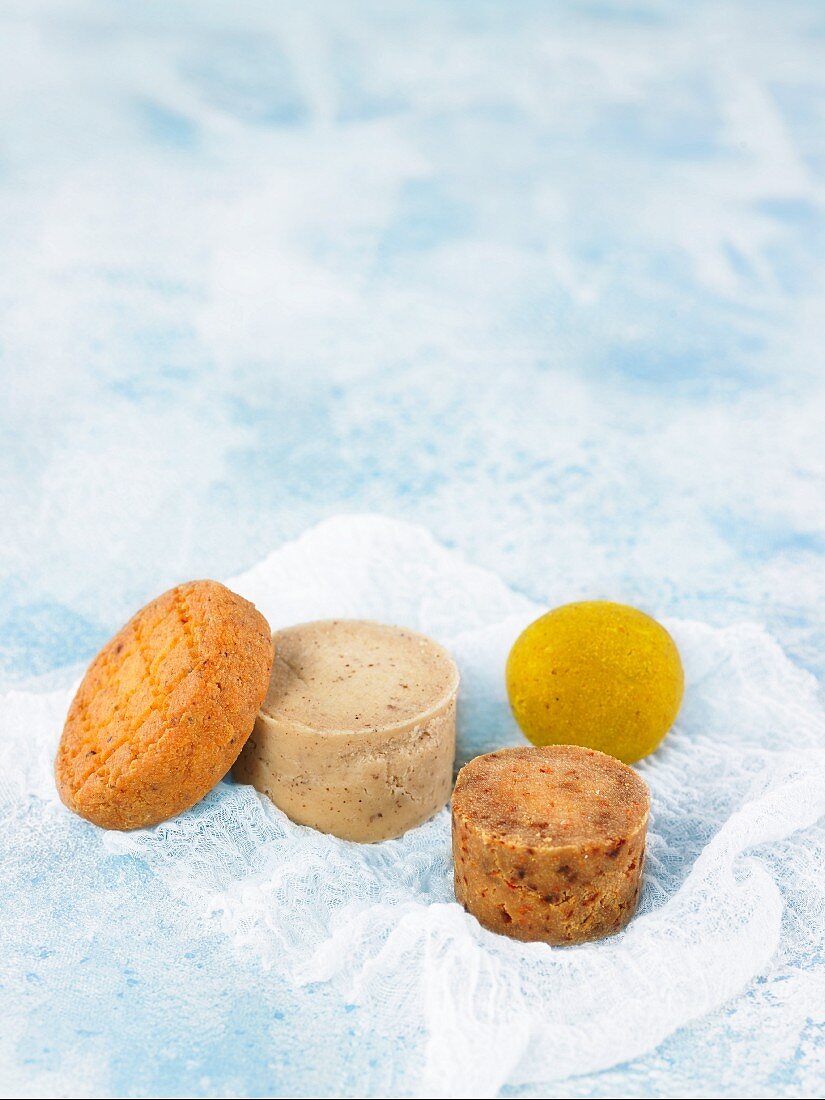 Assorted types of vegan cheese with curry powder and argan oil