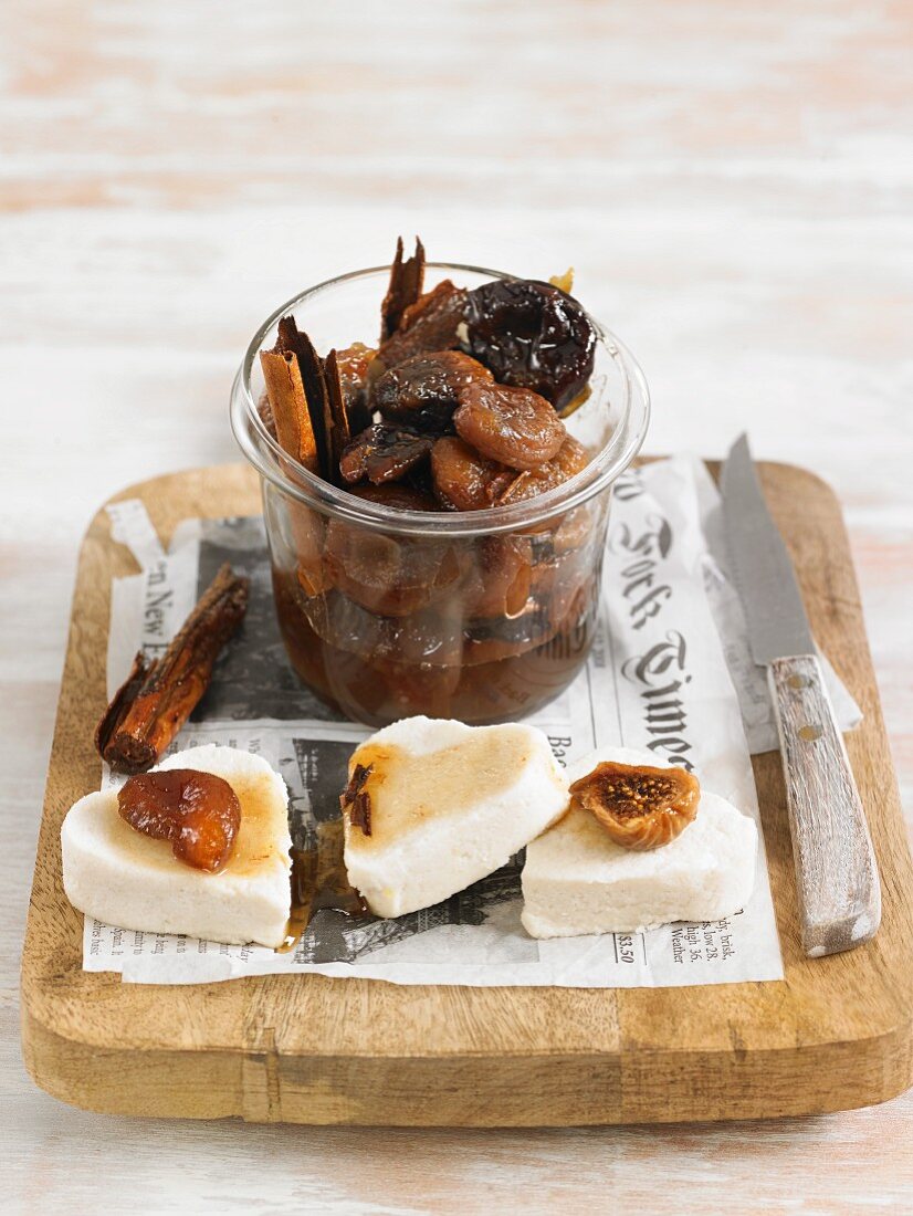 Marinated dried fruit with cinnamon and cloves served with almond cheese