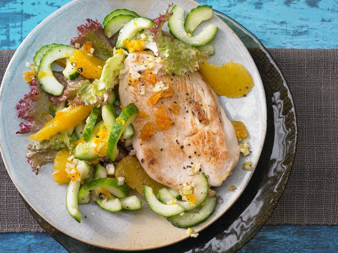 Turkey escalope with orange and cucmber salad