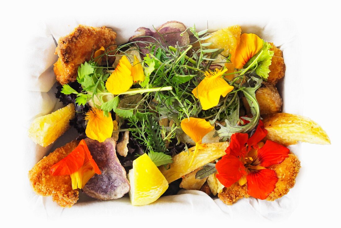 Fish and chips with a flower salad
