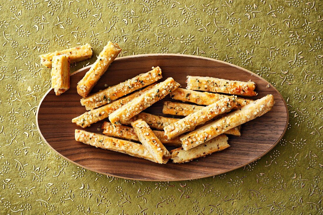 Savoury shortbread sticks with sesame seeds and rosemary