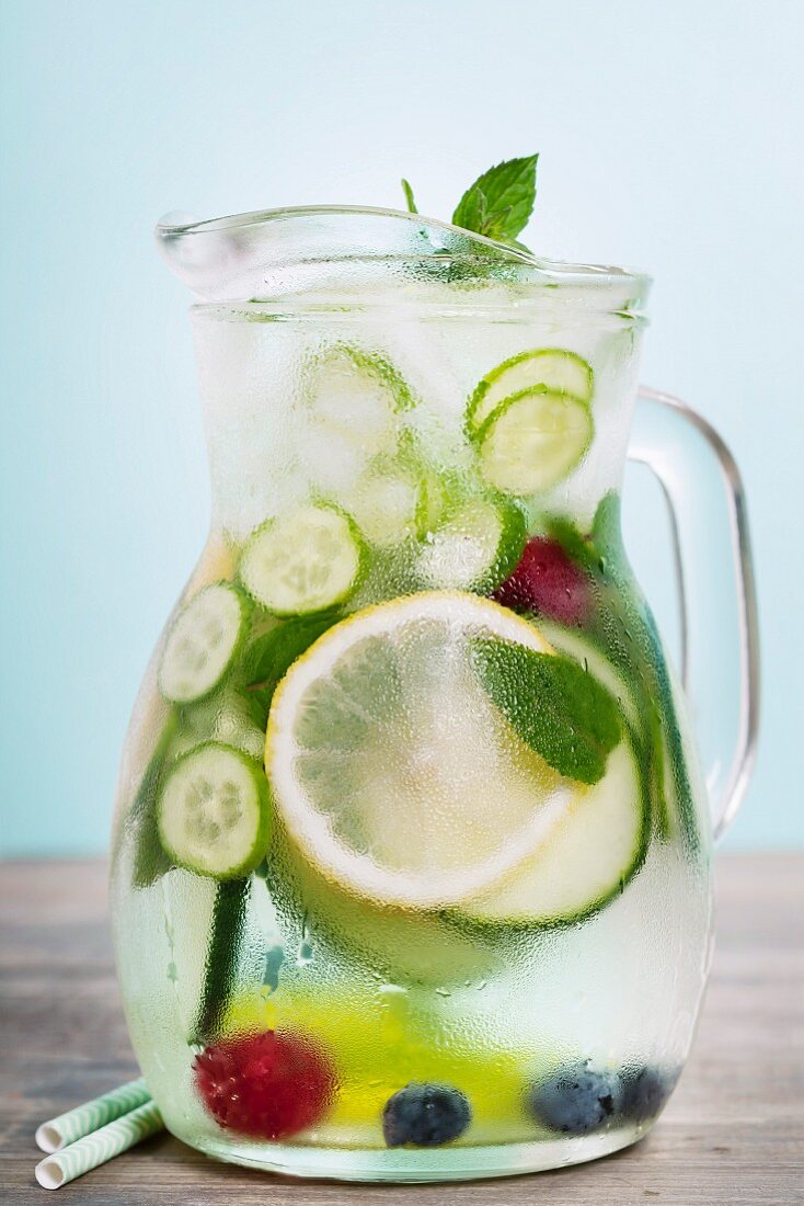 Infused water with cucumber, lemon, lime, berry and mint