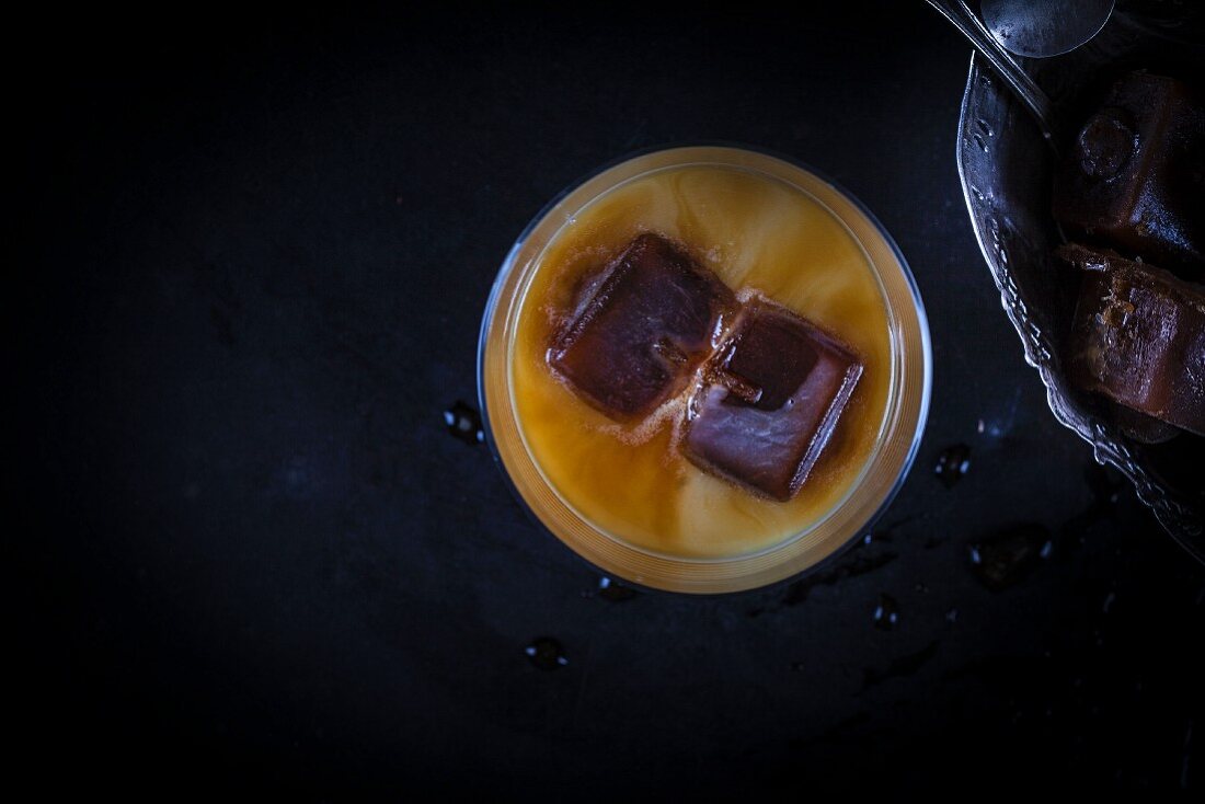 Iced coffee with coconut milk and coffee ice cubes
