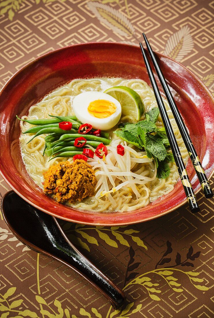 Malaysian curry ramen soup with beansprouts and egg