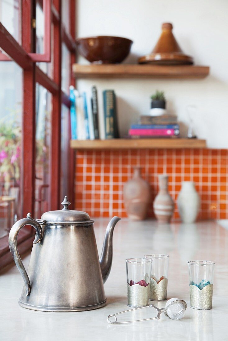 Vintage teapot, tea glasses and tea strainer